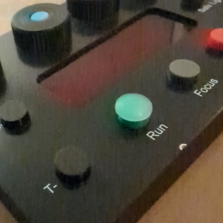 Domed rubber dot on the Run button